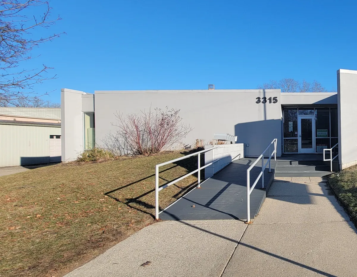 The single-storey building at 3315 South Pennsylvania Avenue, with a ramped walkway to the front doors